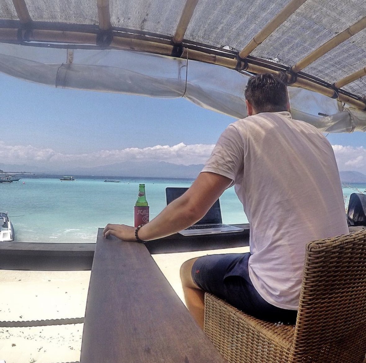 Working on a laptop at a beach bar, Gili Trawangan